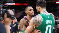 Pelicans' Dejounte Murray talks to Celtics' Jayson Tatum