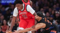 New Orleans Pelicans center Derik Queen (22) and New York Knicks guard Josh Hart (3) fight for a loose ball in the first quarter at Madison Square Garden.