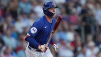 Chicago Cubs center fielder Pete Crow-Armstrong (4) hits against the Cincinnati Reds in the first inning at Sloan Park.