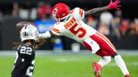 Kansas City Chiefs wide receiver Hollywood Brown (5) reaches for a pass in front of Las Vegas Raiders cornerback Eric Stokes (22) during the fourth quarter at Allegiant Stadium.