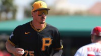 Pittsburgh Pirates shortstop Konnor Griffin (75) returns to the dugout against the St. Louis Cardinals during the second inning at Roger Dean Chevrolet Stadium.