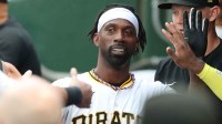 Pittsburgh Pirates designated hitter Andrew McCutchen (22) high-fives in the dugout after scoring a run against the Chicago White Sox at PNC Park.