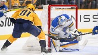 St. Louis Blues goaltender Joel Hofer (30) blocks the shot of Nashville Predators center Jonathan Marchessault (81) during the second period at Bridgestone Arena.