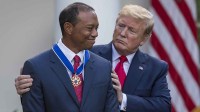 President Donald Trump presents the Presidential Medal of Freedom to Tiger Woods during an event at the White House in the Rose Garden.