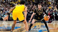 Purdue guard Braden Smith (41) dribbles against Michigan forward Yaxel Lendeborg (23) during the first half of Big Ten Tournament final at United Center in Chicago on Sunday, March 15, 2026.