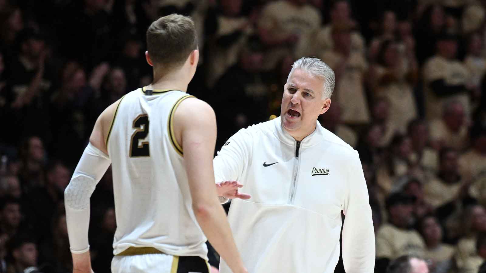 Purdue Boilermakers head coach Matt Painter talks with guard Fletcher Loyer (2) during the first half against the Oregon Ducks at Mackey Arena.
