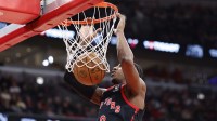 Toronto Raptors forward RJ Barrett (9) scores against the Chicago Bulls during the first half at United Center.