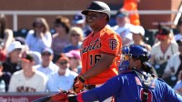 San Francisco Giants designated hitter Rafael Devers (16) reacts after missing a pitch against the Chicago Cubs in the third inning at Scottsdale Stadium.