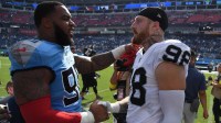 Tennessee Titans defensive tackle Jeffery Simmons (98) and Las Vegas Raiders defensive end Maxx Crosby (98) after a Titans win at Nissan Stadium.
