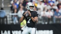 Las Vegas Raiders quarterback Geno Smith (7) looks to throw in the first quarter against the New York Giants at Allegiant Stadium.