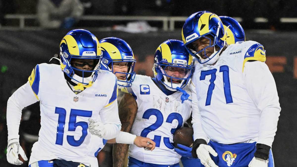 Los Angeles Rams running back Kyren Williams (23) celebrates with wide receiver Konata Mumpfield (15), quarterback Matthew Stafford (9) and offensive tackle Warren McClendon Jr. (71) after scoring a touchdown against the Chicago Bears during the fourth quarter of an NFC Divisional Round game at Soldier Field.