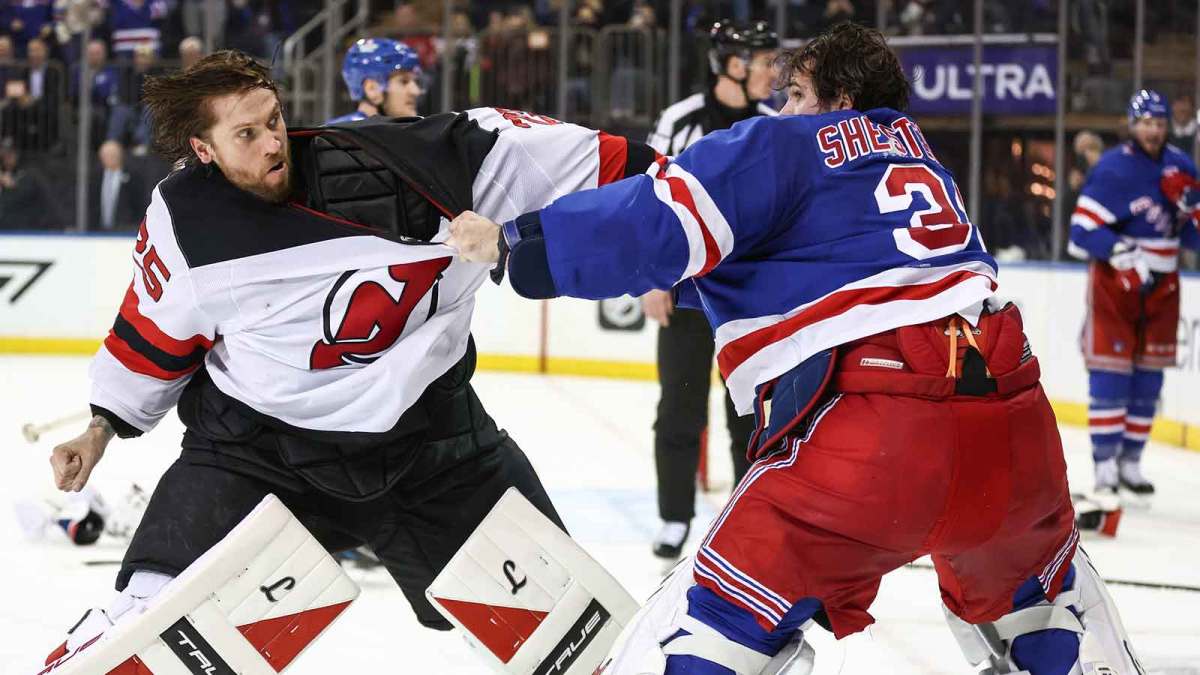 New York Rangers goaltender Igor Shesterkin (31) and New Jersey Devils goaltender Jacob Markstrom (25) fight in the third period at Madison Square Garden.