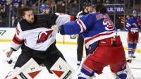 New York Rangers goaltender Igor Shesterkin (31) and New Jersey Devils goaltender Jacob Markstrom (25) fight in the third period at Madison Square Garden.