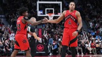 Raptors forward Scottie Barnes (4) celebrates a play with guard Jamal Shead