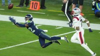 Seattle Seahawks wide receiver Rashid Shaheed (22) cannot catch a pass while defended by New England Patriots cornerback Carlton Davis III (7) in the second half in Super Bowl LX at Levi's Stadium.