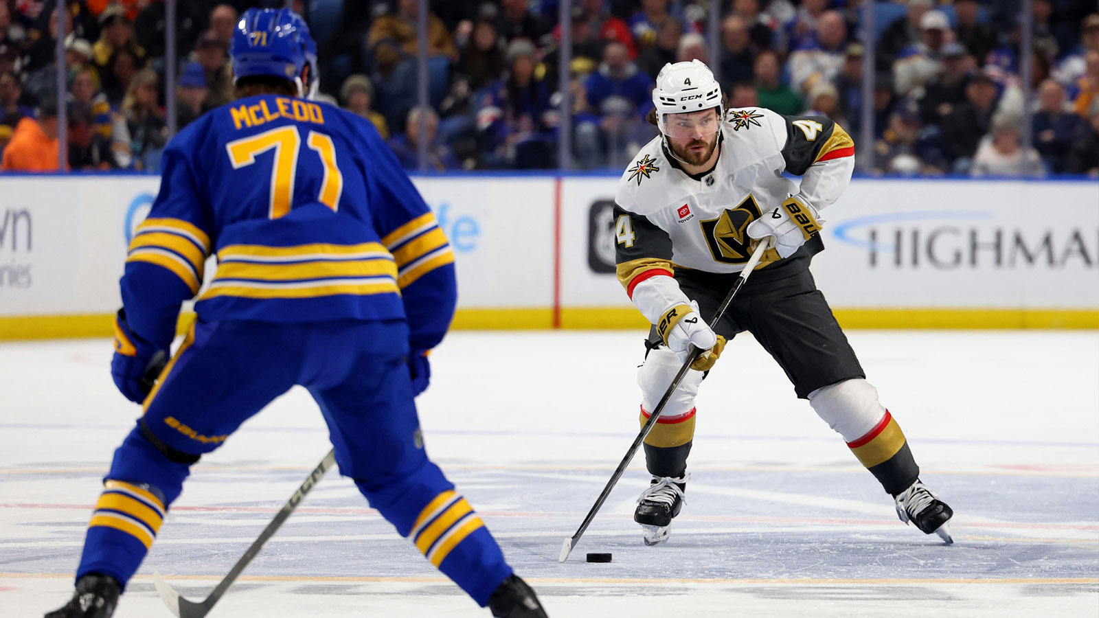 Buffalo Sabres center Ryan McLeod (71) looks to defend as Vegas Golden Knights defenseman Rasmus Andersson (4) carries the puck up the ice during the first period at KeyBank Center.