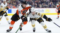 Philadelphia Flyers defenseman Rasmus Ristolainen (55) and Boston Bruins center Morgan Geekie (39) battle for position in the third period at Xfinity Mobile Arena.