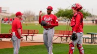 Cincinnati Reds pitching coach/director of pitching Derek Johnson (36) wraps up a bullpen session with pitcher Hunter Greene (21) at the Cincinnati Reds player development complex in Goodyear, Ariz., on Friday, Feb. 13, 2026.
