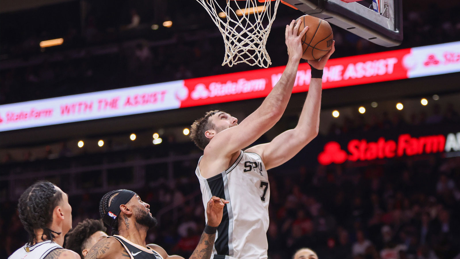 San Antonio Spurs center Luke Kornet (7) shoots against the Atlanta Hawks in the second quarter at State Farm Arena.