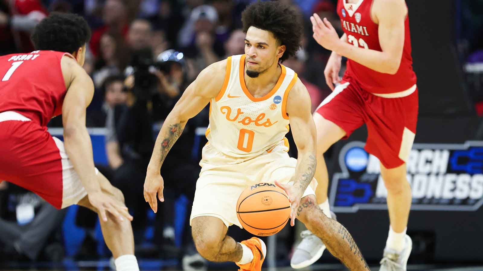 Tennessee Volunteers guard Ja'kobi Gillespie (0) dribbles as Miami (OH) RedHawks guard Trey Perry (1) defends during the second half during a first round game of the men's 2026 NCAA Tournament at Xfinity Mobile Arena.