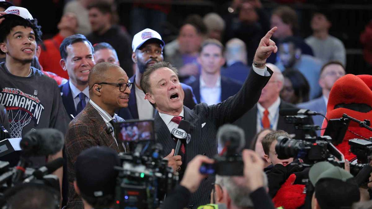 St. John's Red Storm head coach Rick Pitino with Fox Sports Gus Johnson following the men's Big East Conference Tournament Championship against the Connecticut Huskies at Madison Square Garden.