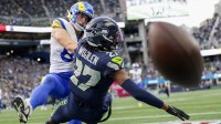 Seattle Seahawks cornerback Riq Woolen (27) breaks up a pass intended for Los Angeles Rams tight end Davis Allen (87) during the fourth quarter at Lumen Field.