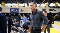 Los Angeles Lakers general manager Rob Pelinka leaves a press conference to preview the 2025-26 season at UCLA Health Training Center.