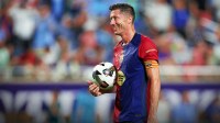 Barcelona forward Robert Lewandowski (9) gets ready to take a penalty kick in a tie breaker during a Champions Tour friendly match against Manchester City at Camping World Stadium.