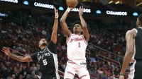 Rockets guard Amen Thompson (1) shoots vs. Spurs' Stephon Castle