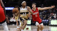 Rockets guard Reed Sheppard (15) defends