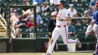 Minnesota Twins center fielder Alan Roden (18) scores a run against Puerto Rico in the third inning during spring training at Lee Health Sports Complex/Hammond Stadium.