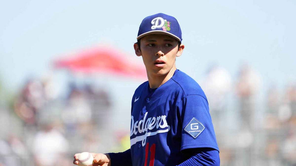 Los Angeles Dodgers starting pitcher Roki Sasaki (11) pitches against the Cleveland Guardians during the third inning at Goodyear Ballpark.