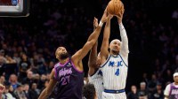 Orlando Magic guard Jalen Suggs (4) secures a rebound over Minnesota Timberwolves center Rudy Gobert (27) in the fourth quarter at Target Center. Mandatory Credit: Matt Blewett-Imagn Images