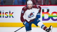 Colorado Avalanche center Ryan Johansen (12) stretches on the ice during warm-up before the game against the Montreal Canadiens at Bell Centre.
