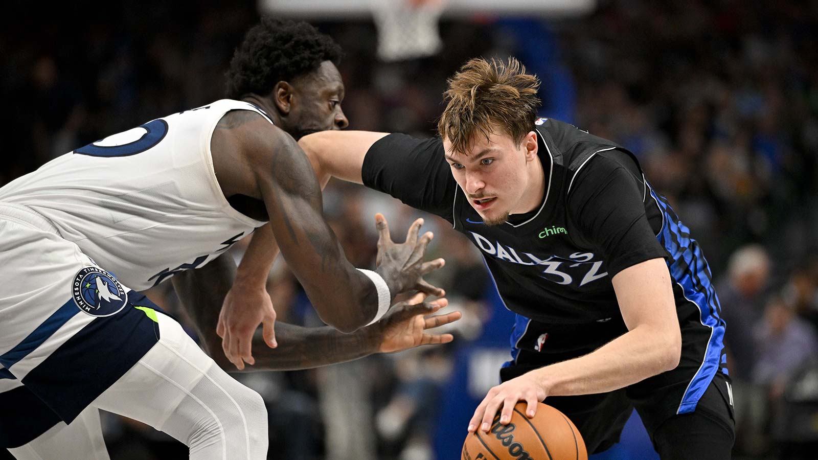 Dallas Mavericks forward Cooper Flagg (32) drives to the basket past Minnesota Timberwolves forward Julius Randle (30) during the second half at the American Airlines Center.
