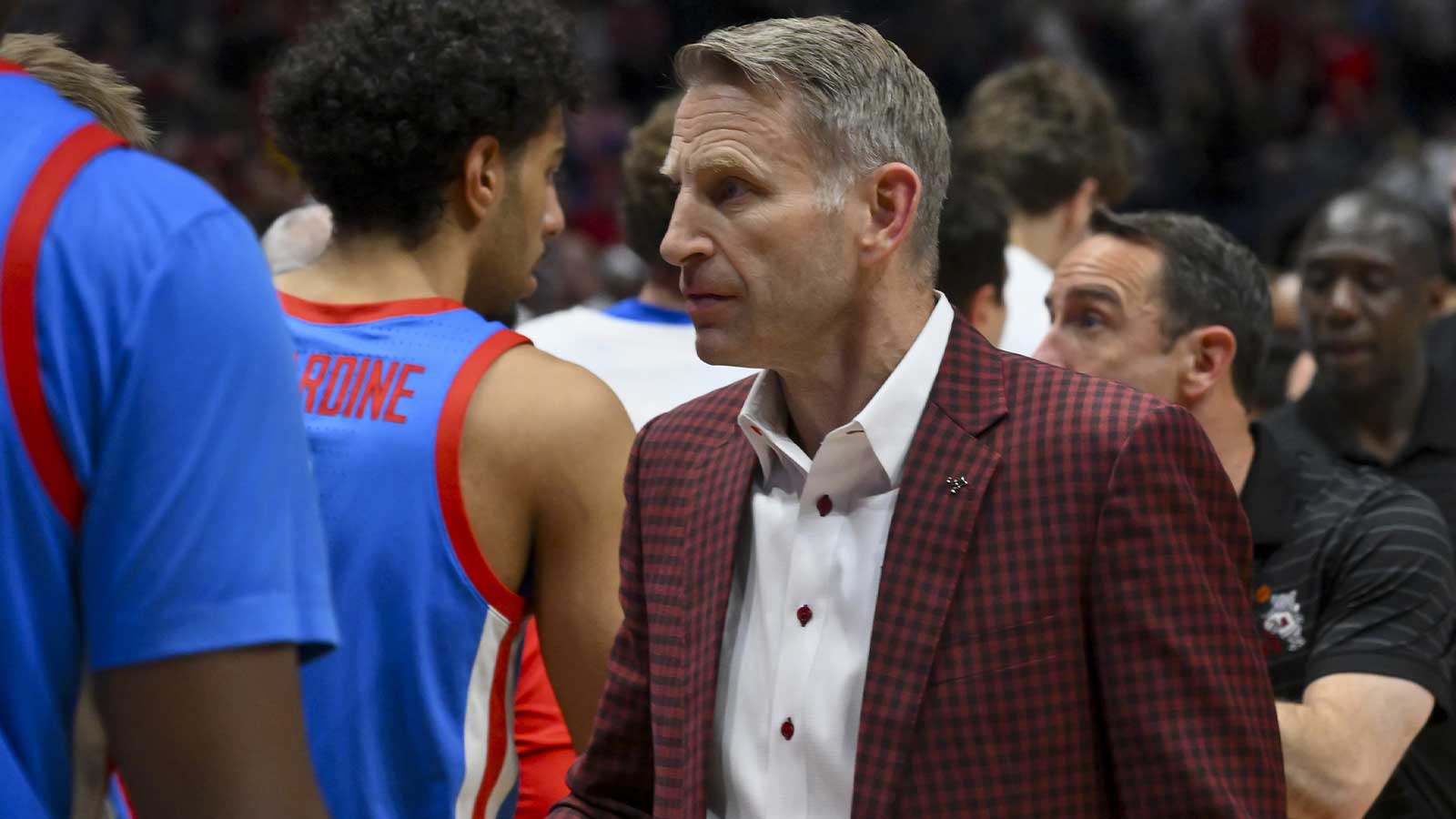 Alabama Crimson Tide head coach Nate Oats shakes hands with the Mississippi Rebels players after the game at Bridgestone Arena.