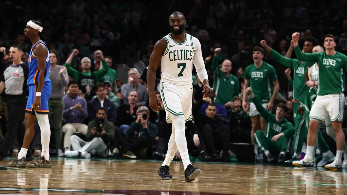 Celtics guard Jaylen Brown smiles after being fouled while making a shot by Oklahoma City Thunder guard Shai Gilgeous-Alexander (2) (left) during the fourth quarter at TD Garden