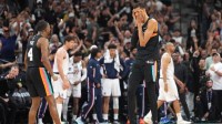 San Antonio Spurs forward Victor Wembanyama (1) and guard De’Aaron Fox (4) react after securing a comeback victory over the Los Angeles Clippers at Frost Bank Center.