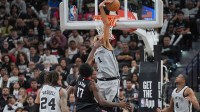 San Antonio Spurs forward Victor Wembanyama (1) blocks a shot by Houston Rockets forward Tari Eason (17) in the second half at Frost Bank Center.