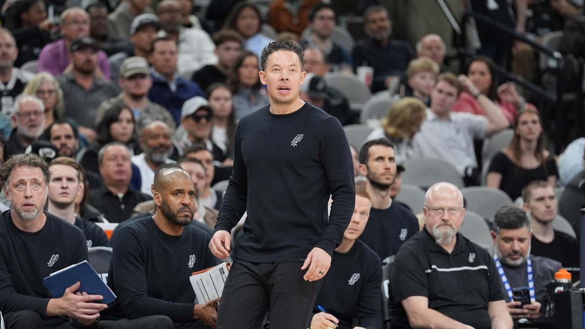 San Antonio Spurs head coach Mitch Johnson look on in the first half against the Houston Rockets at Frost Bank Center.