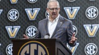 SEC commissioner Greg Sankey introduces Vanderbilt Commodores head coach Mark Byington during SEC Media Days at Grand Bohemian Hotel.