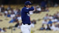 Los Angeles Dodgers pitcher Roki Sasaki (11) reacts after allowing a walk during the first inning against the Los Angeles Angels at Dodger Stadium.