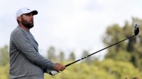 Scottie Scheffler watches his tee shot on the third hole during the first round of the The Genesis Invitational golf tournament at Riviera Country Club