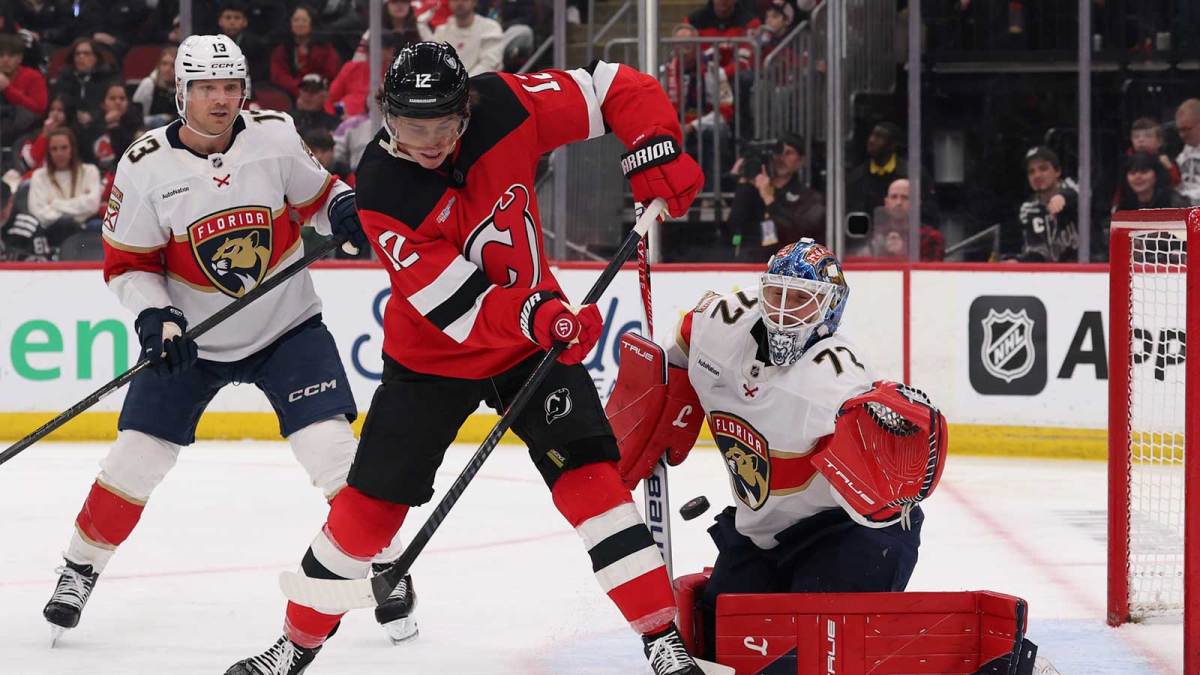 New Jersey Devils center Cody Glass (12) scores a goal on Florida Panthers goaltender Sergei Bobrovsky (72) during the second period at Prudential Center.