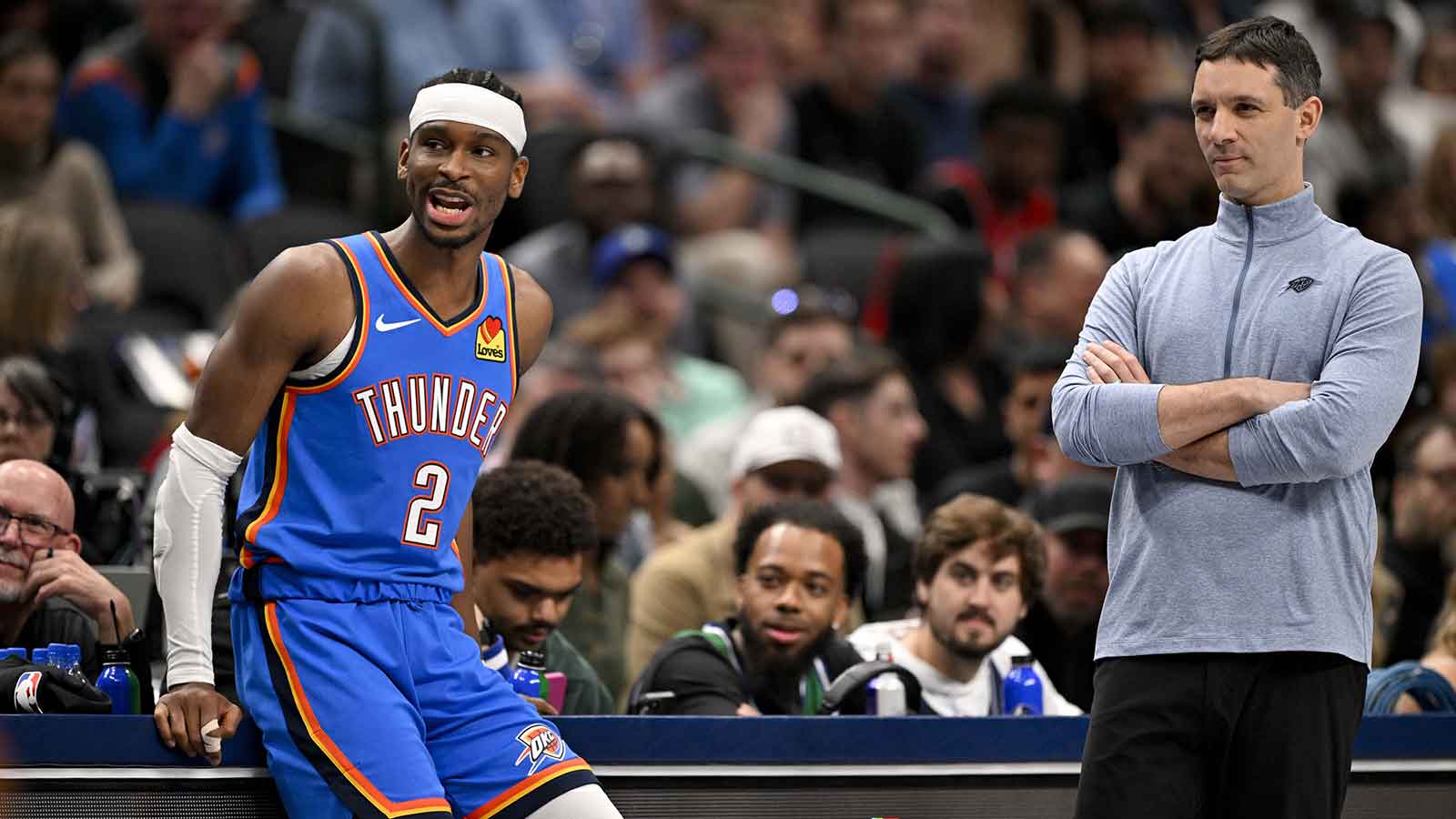Oklahoma City Thunder guard Shai Gilgeous-Alexander (2) and head coach Mark Daigneault look on during the second quarter against the Dallas Mavericks at the American Airlines Center.