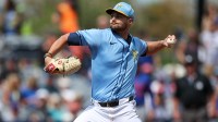 Tampa Bay Rays pitcher Shane McClanahan (18) throws a pitch against the New York Mets in the first inning during spring training at Charlotte Sports Park.