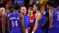 Kansas Jayhawks head coach Bill Self (center) in the huddle with his players against the Arizona State Sun Devils in the first half at Desert Financial Arena.