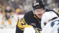 Pittsburgh Penguins center Sidney Crosby (87) looks on at the face-off circle against Winnipeg Jets center Morgan Barron (36) during the first period at PPG Paints Arena.