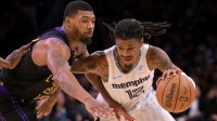 Los Angeles Lakers guard Marcus Smart (36) defends Memphis Grizzlies guard Ja Morant (12) as he drives to the basket in the second half at Crypto.com Arena.