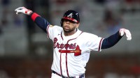 Atlanta Braves first baseman Dominic Smith (8) hits a walk-off grand slam against the Kansas City Royals in the ninth inning at Truist Park.